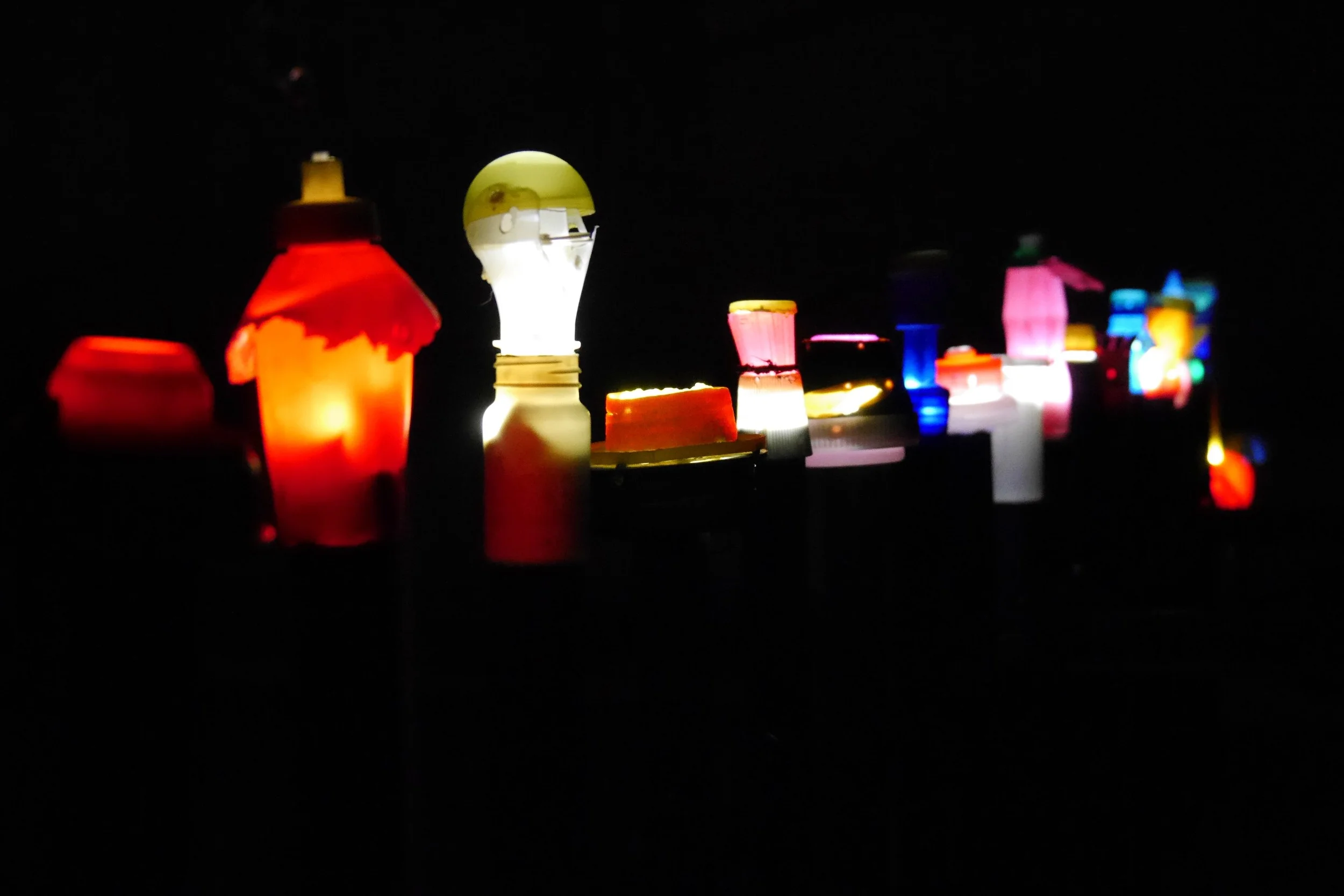  Original lamps made from beach plastic forming a string of lights in the Light Wave.&nbsp; Momentum for the wave is generated by a wind turbine made from a barrel found on the beach. 