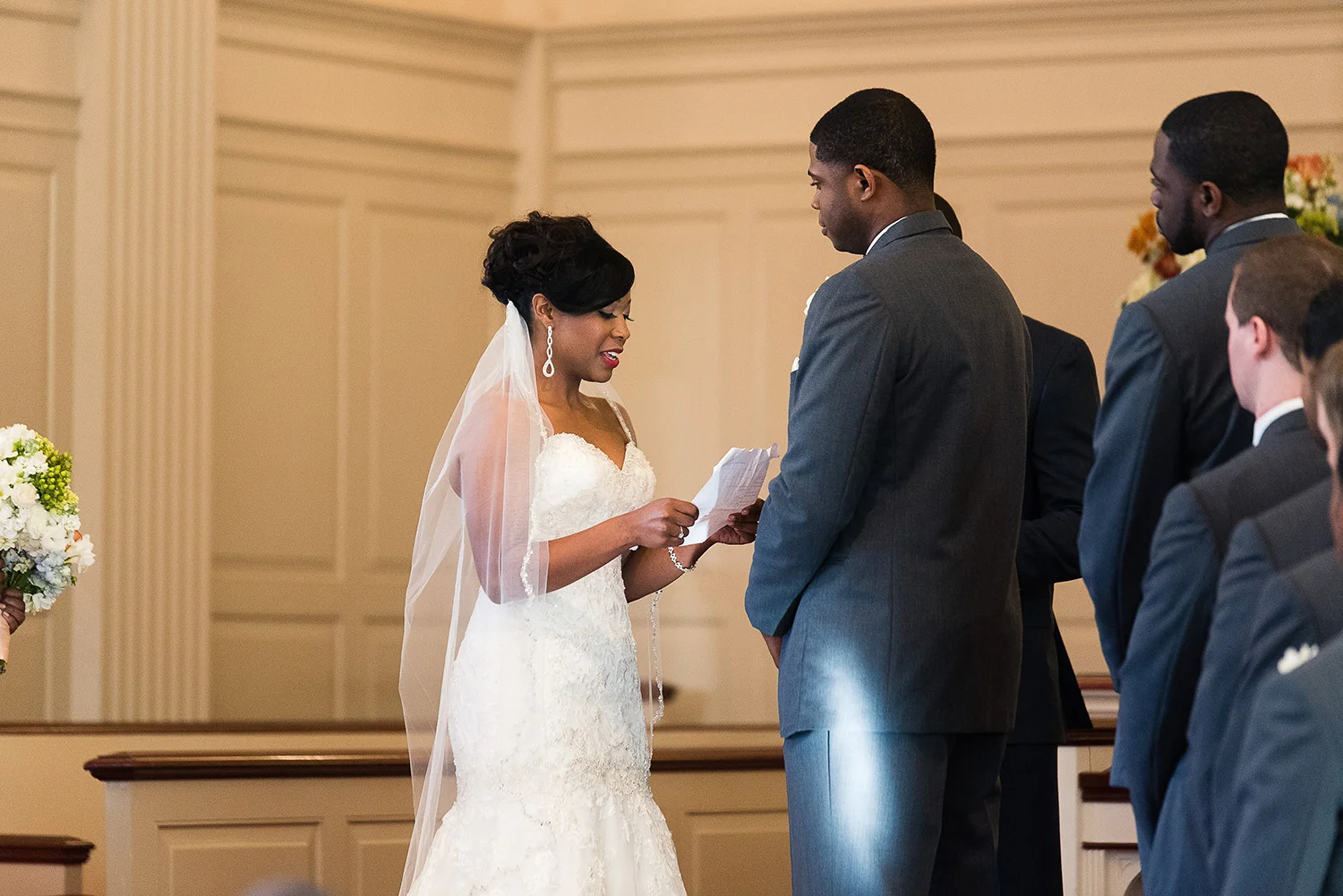 This fall wedding was in a chapel with white walls, but was still sort of dark inside. We were about 2-3 hours prior to sunset at this point. The light coming through the right side window can be seen with the highlight on the groom's hip. 