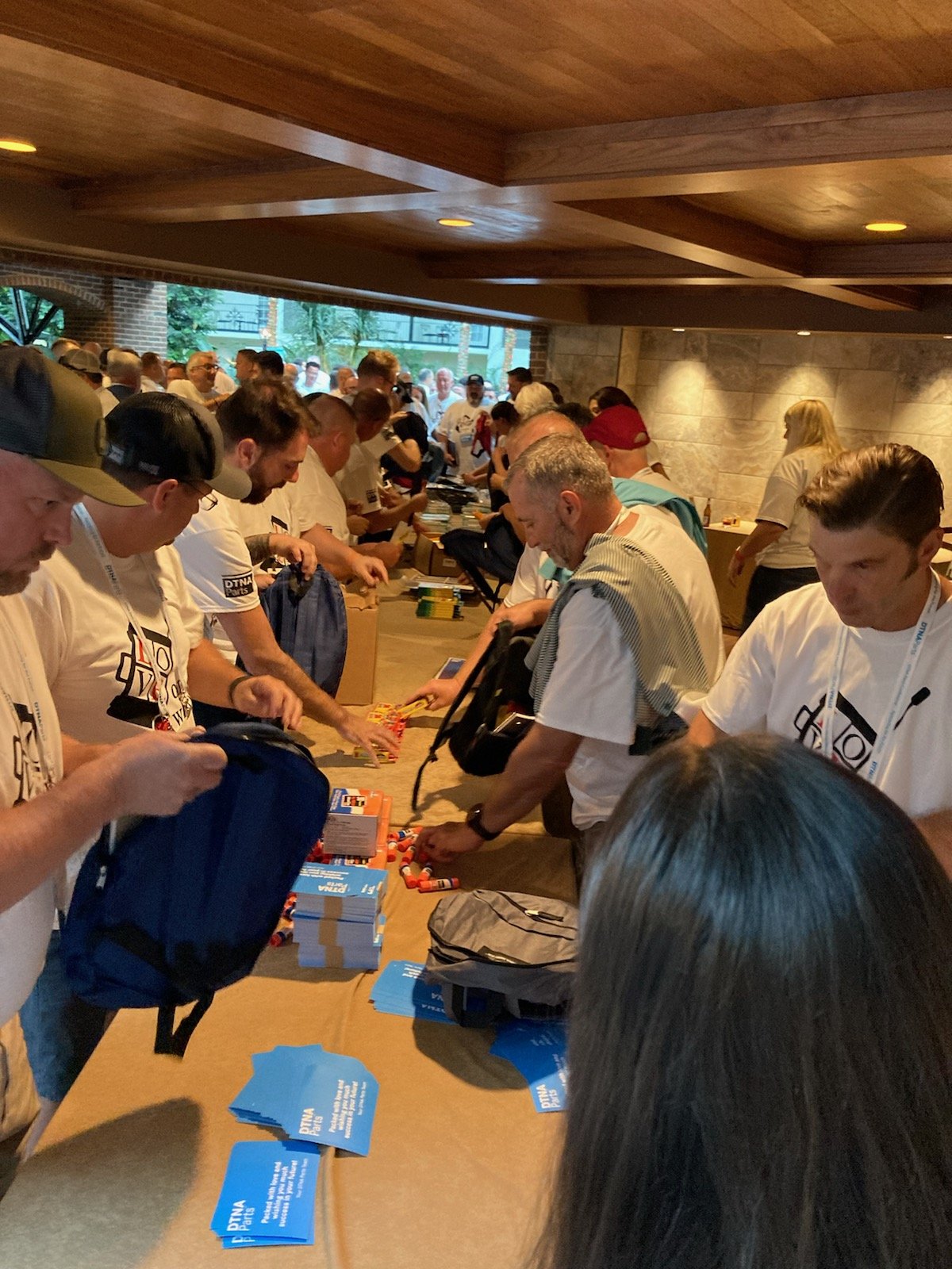 August 2022: Creative Solutions and DTNA from Ohio packed and donated 500 filled backpacks and Love on Wheels T-shirts.