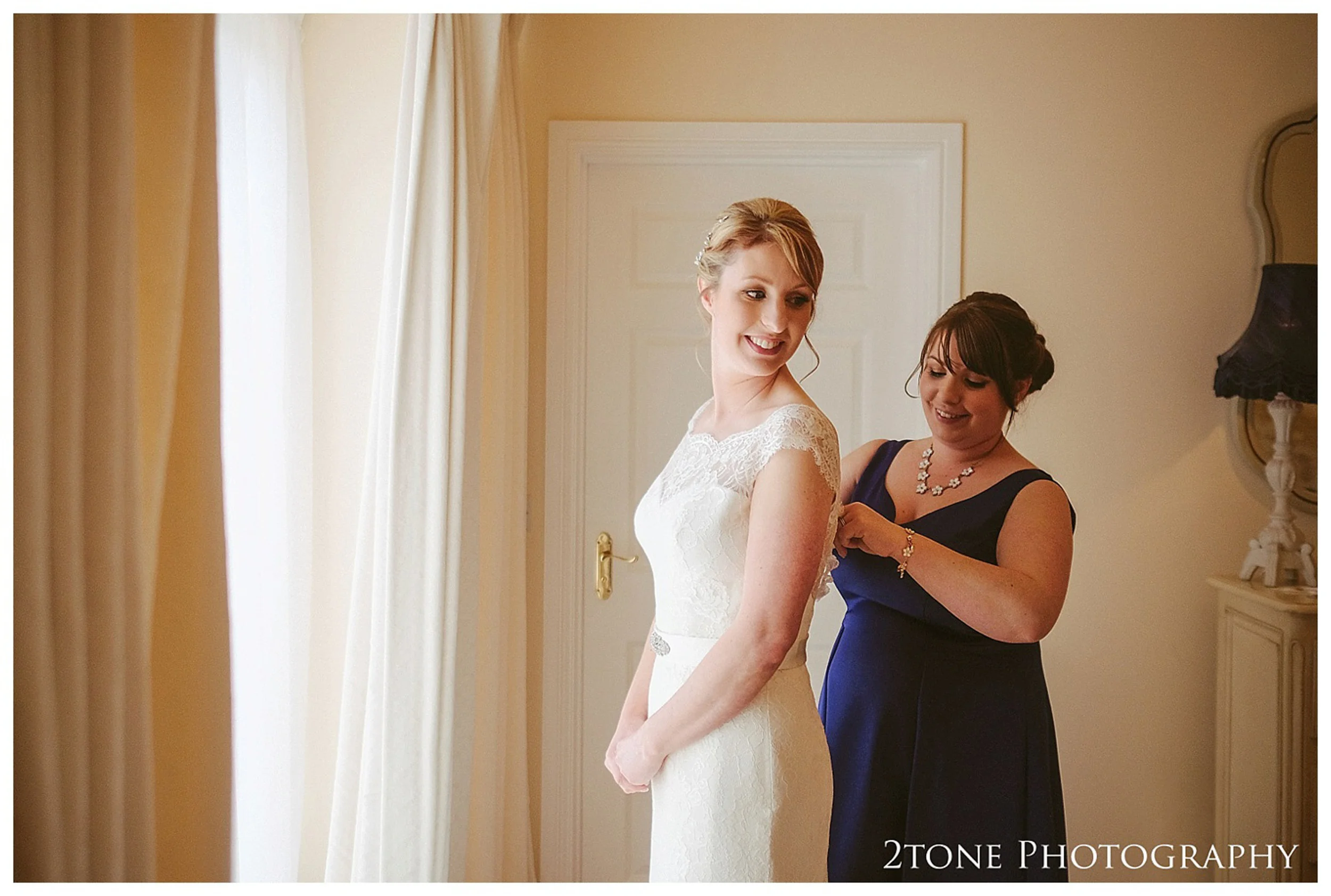 Bridal preparations. Eshott Hall wedding photographs by wedding photographers based in Durham and the North East. www.2tonephotography.co.uk.
