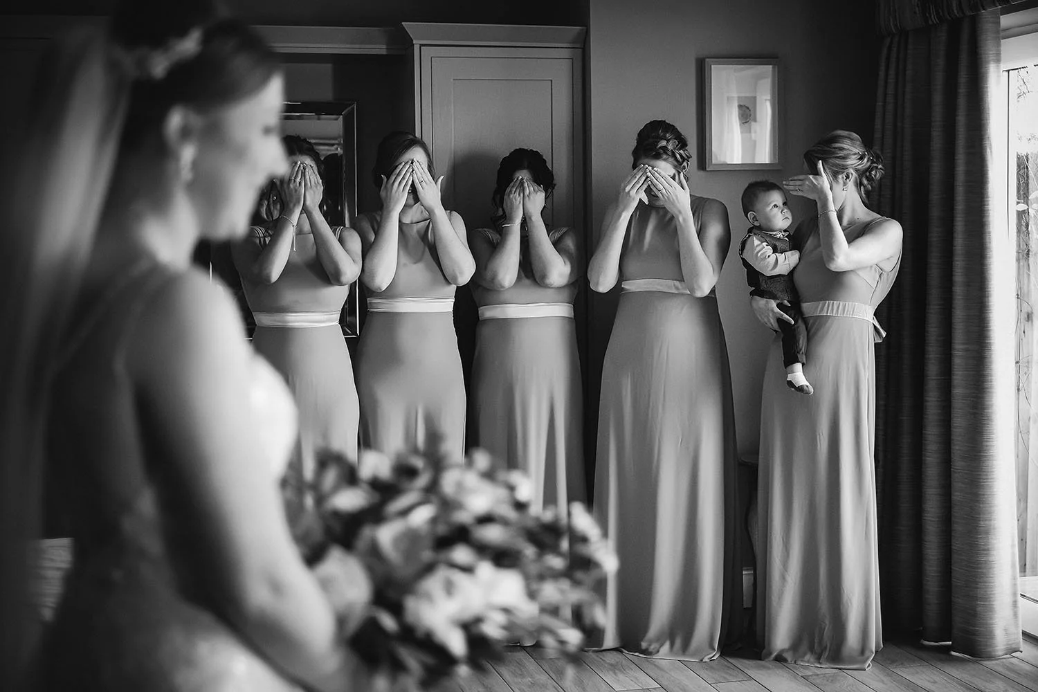 The Black Horse, Beamish wedding: bridesmaids covering their eyes while the bride, holding her bouquet, stands in the foreground