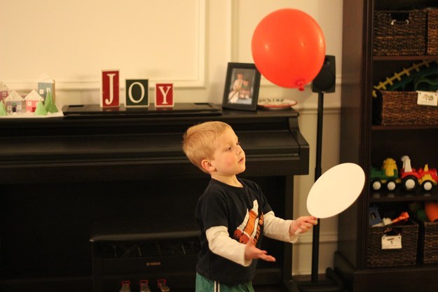 All you need are a couple of balloons, some paper plates and plastic spoons. Definitely Toddler Approved .
