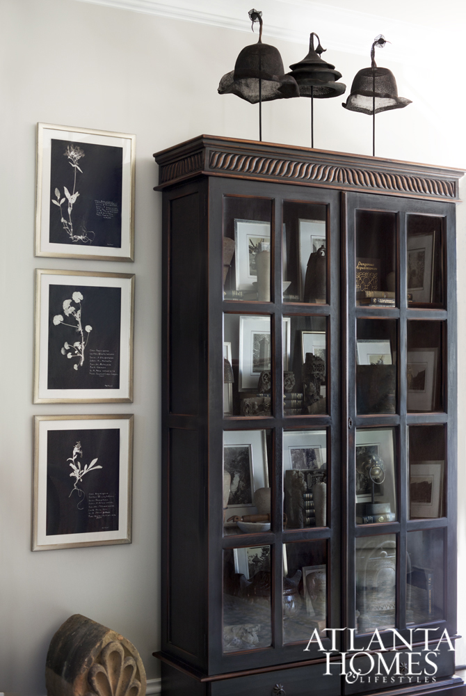 TWO-DOOR CABINET and DECORATIVE HATS on stands by Chip and Company