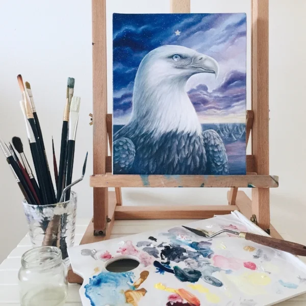 Work in progress photo of 'Guardian Spirit', my painting palette and a jar of glazing medium.