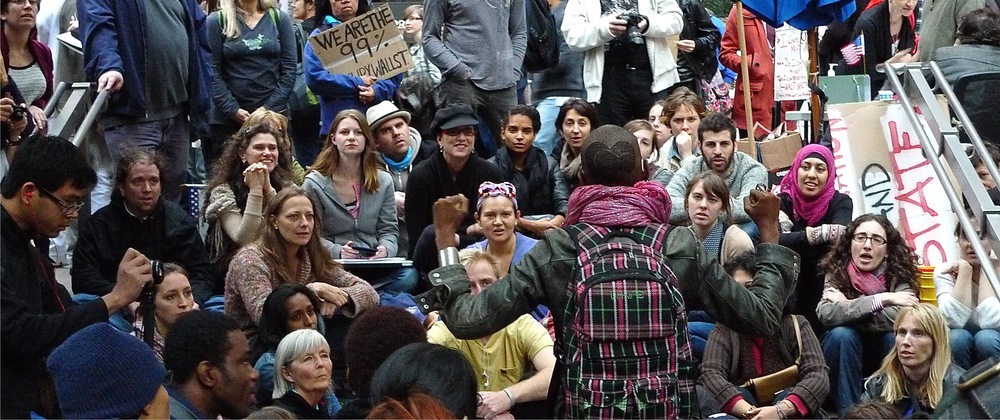 Eve Ensler listening to a young woman telling her story (with the "human microphone") at Zuccotti Park during Occupy Wall Street. October 2011.