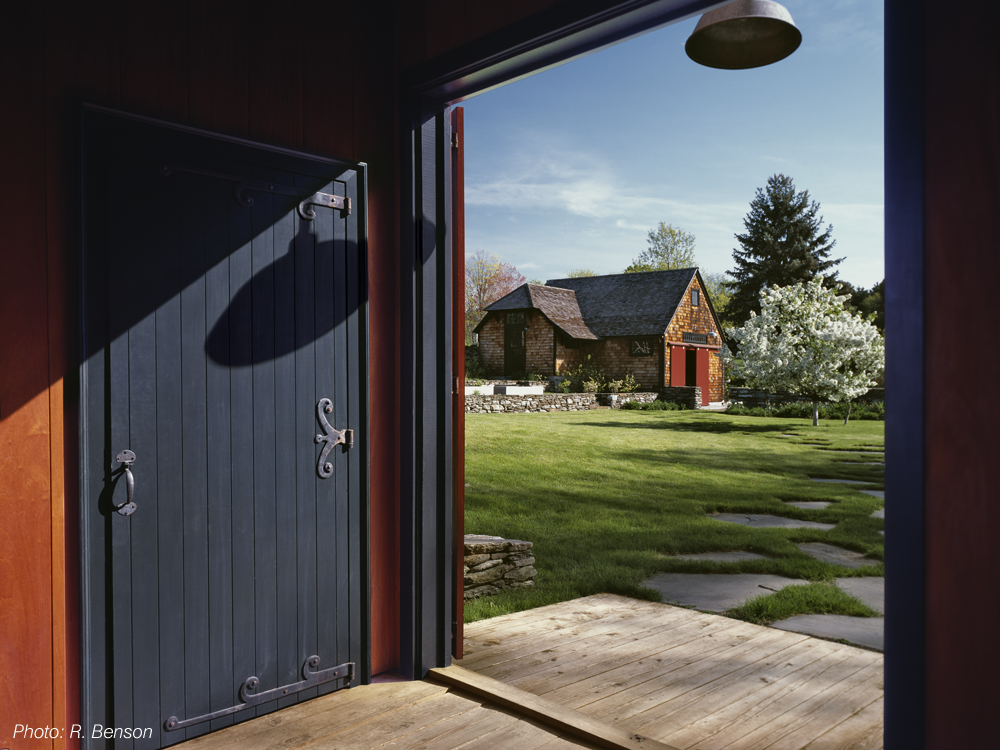 The architecture of this home, a contemporary interpretation of a classic farm complex, reflects the history of the site while looking to the future. The landscape responds to this by using local stone, a simple plant palette, and the remnants of old structures in the landscape composition. The future is celebrated by technology; photovoltaic cells powering the house and barn are placed in a field to appear as sculptural elements in the larger landscape. The project received a 2008 BSA Honor Award for Design.