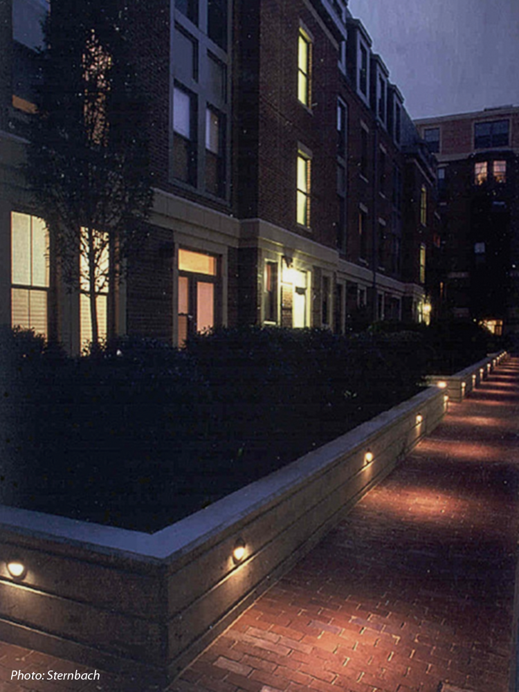 This 184-unit housing development was built on approximately two acres of vacant land. A goal for the project was to provide the City with significant open space. To achieve this, a 277 space, below grade parking garage was created with a park on its surface. Thus, the park at grade level is in reality a rooftop garden. This green space is a contemporary interpretation of the traditional South End Square. 