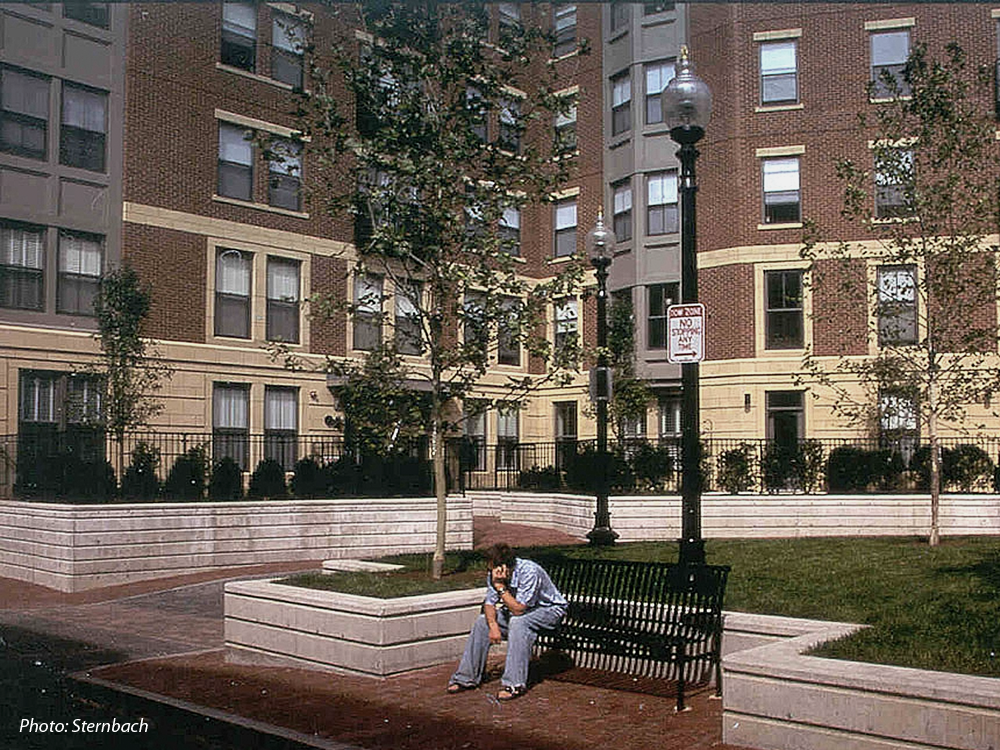 This 184-unit housing development was built on approximately two acres of vacant land. A goal for the project was to provide the City with significant open space. To achieve this, a 277 space, below grade parking garage was created with a park on its surface. Thus, the park at grade level is in reality a rooftop garden. This green space is a contemporary interpretation of the traditional South End Square. 