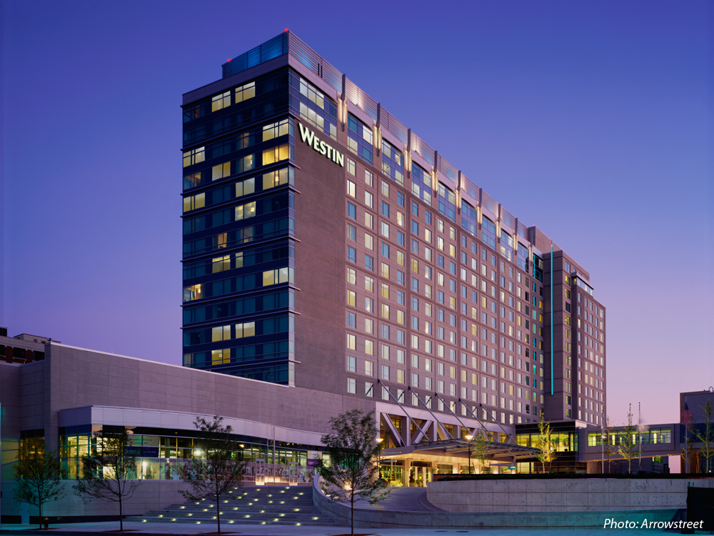 This hotel was built to service the city’s new convention center in South Boston. The siting of the hotel provided the opportunity to create a new urban plaza, which is linked to the Convention Center through the use of bold paving patterns and raised planters. A wide band of landscape steps connect Summer Street to the plaza and the hotel’s main entrance. New streetscapes were designed along Summer and D Streets.