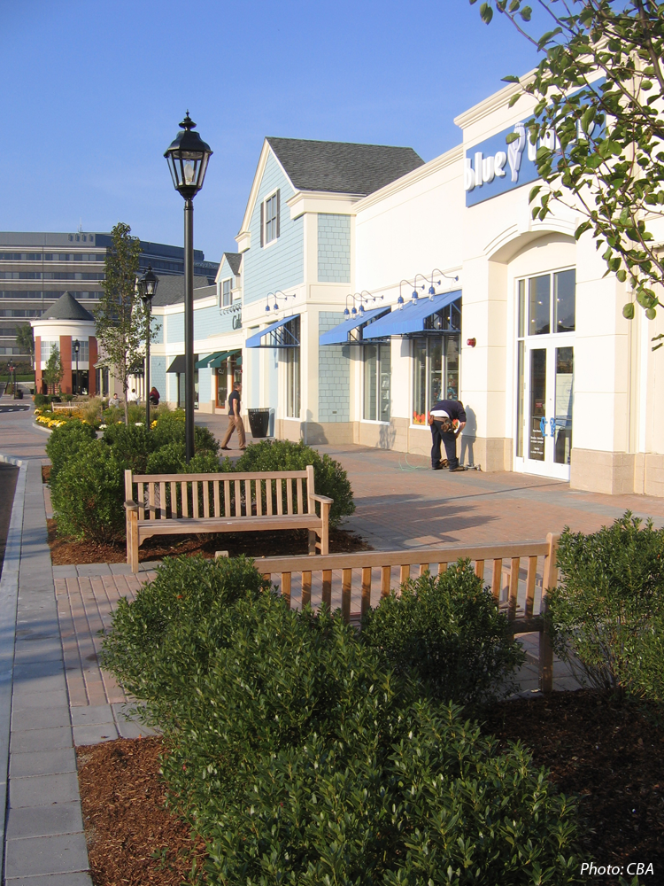  Wayside Commons is a new “Lifestyle Center” shopping mall. The design goal was to develop a beautiful and functional shopping center that embodies a spirit of place. A generous amount of open space was landscaped to create an attractive setting for the shops. CBA designed tree-lined walks, a gazebo, vine-covered arbor, and numerous green spaces. Outdoor cafes and sitting areas throughout the development are typical site amenities. 