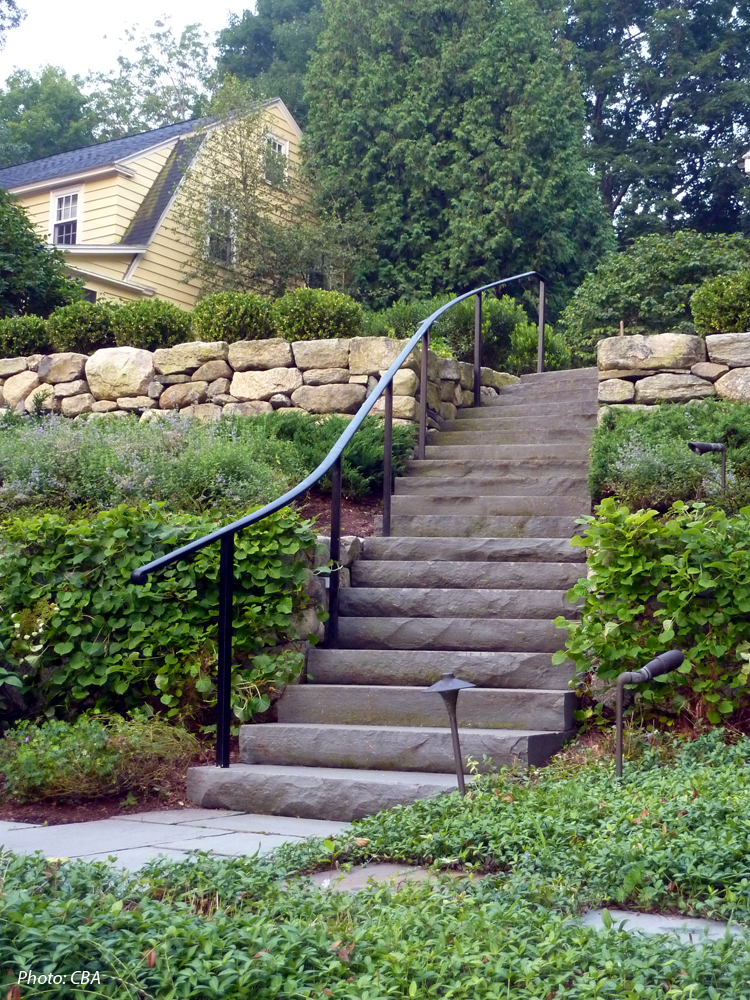  As detailed in the 2010 article "Hillside Havens" in Backyard Solutions Magazine, CBA turned what had been a neglected, overgrown hillside into unique, usable spaces. Graceful, curving stone walls tie three terraced spaces together, creating a unifi
