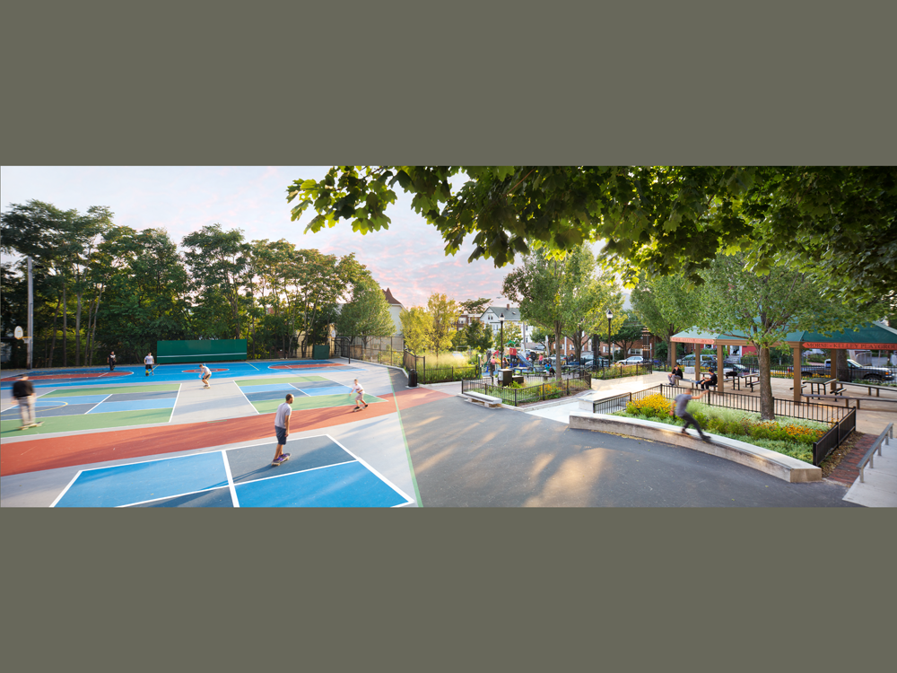 A true urban park for all ages, neighborhood input led this space to become the first public space in Somerville to include skateboarding as one of the featured activities. The skate elements are designed to fit into the overall design and to have alternate uses, such as seating and access. The park also features a four-sport court area, a vibrant tot lot, a new community garden, a rock climbing wall, extensive drought-tolerant plantings, a new entry plaza with monumental metal columns, and seating throughout the site. 