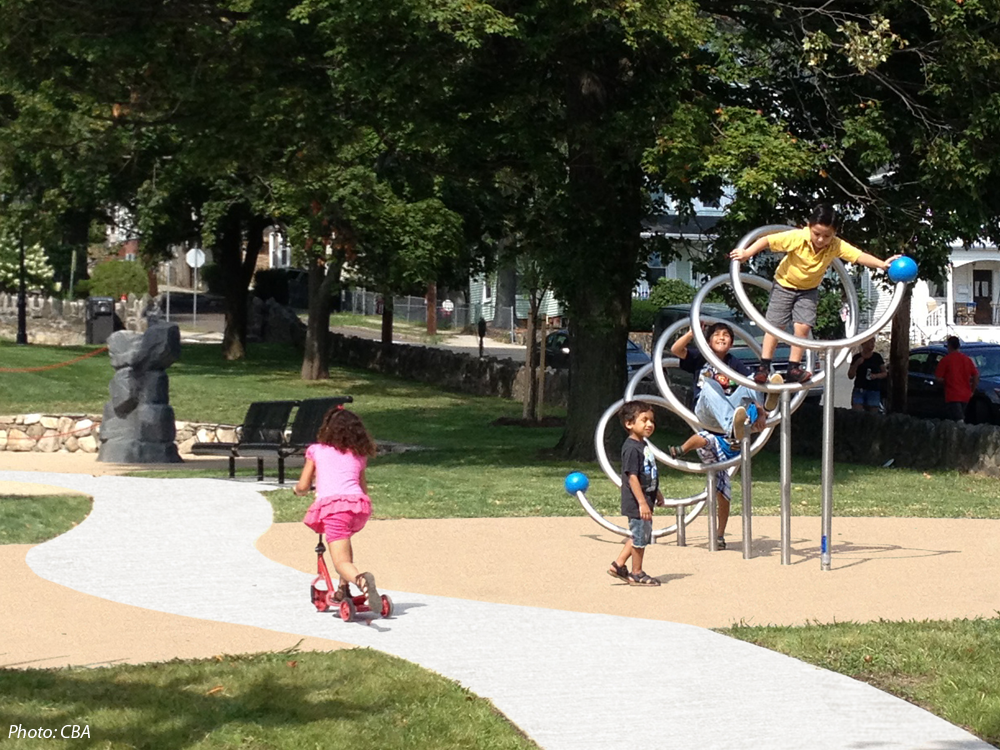  CBA's design for this neighborhood “commons” strikes a balance between refurbishing an historic greenspace and providing new activities. The site's defining diagonal walkways are joined by a meandering path connecting several new play features, sele