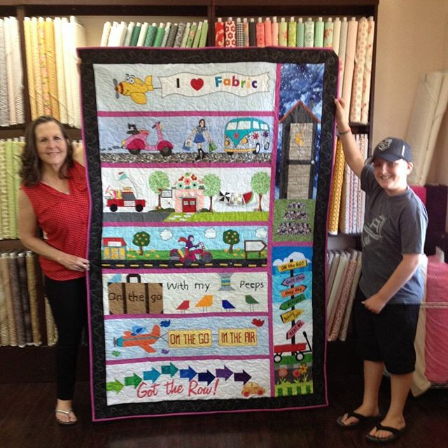 Congratulations to Mary Kate Erickson who won our Row by Row Challenge---both prizes. She was first to bring in a finished quilt and first to use our row in a finished quilt. She won a stack of 25 fat quarters and the book &quot;12-Pack Quilts&quot; 