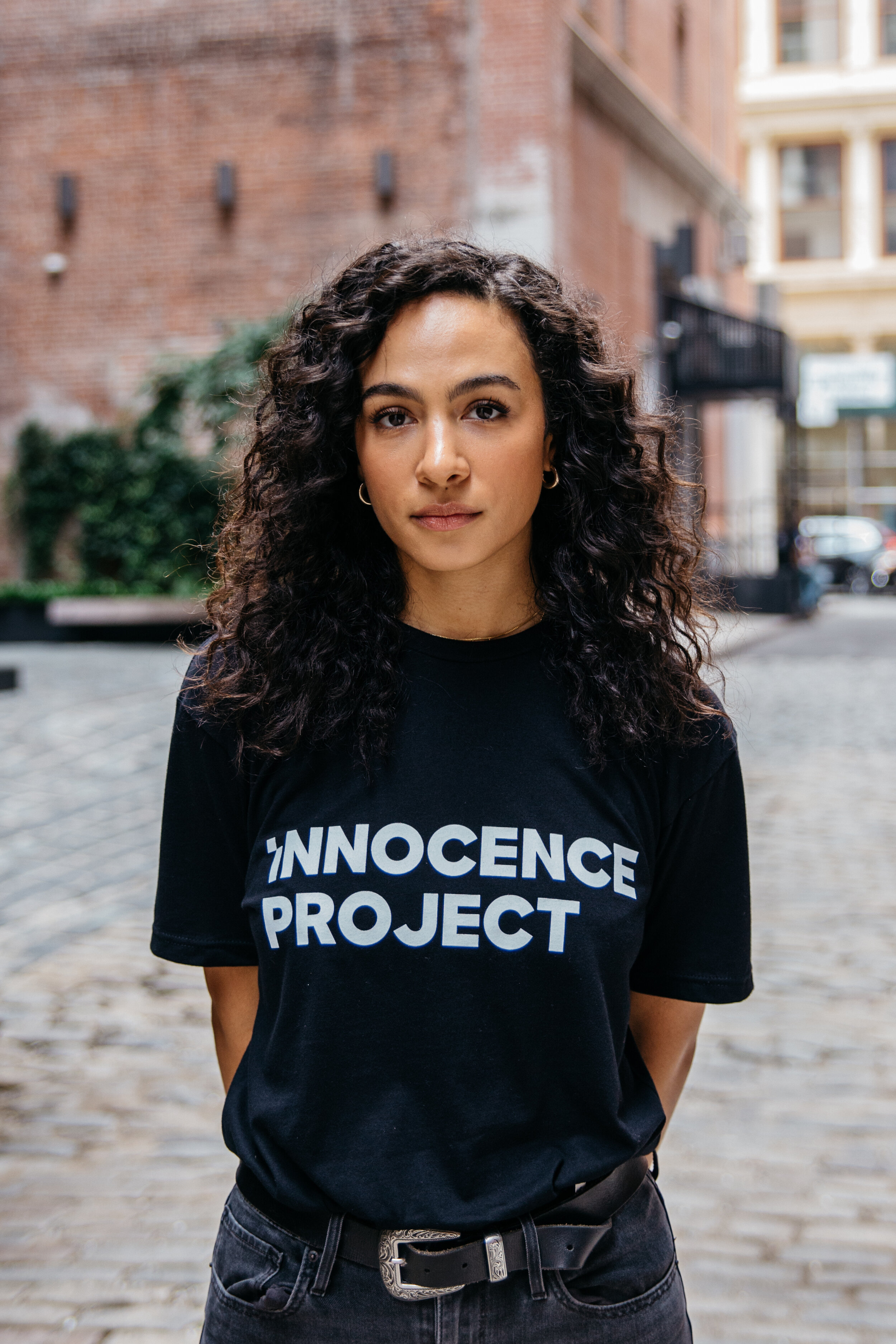  Aurora Perrineau wearing a black Innocence Project t-shirt, a part of the Wrongful Conviction Day campaign.  