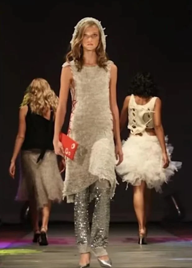 "Michael Drummond at the Threads 4 Hope charity fashion show, St. Louis, 2005, worn by Karlie Kloss in the show where she was discovered. Deadstock chenille, red cotton lacing, silver sequin legwarmers. Bag by CLING.