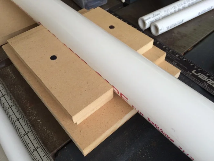 Pipe drilling jig made from scrap MDF