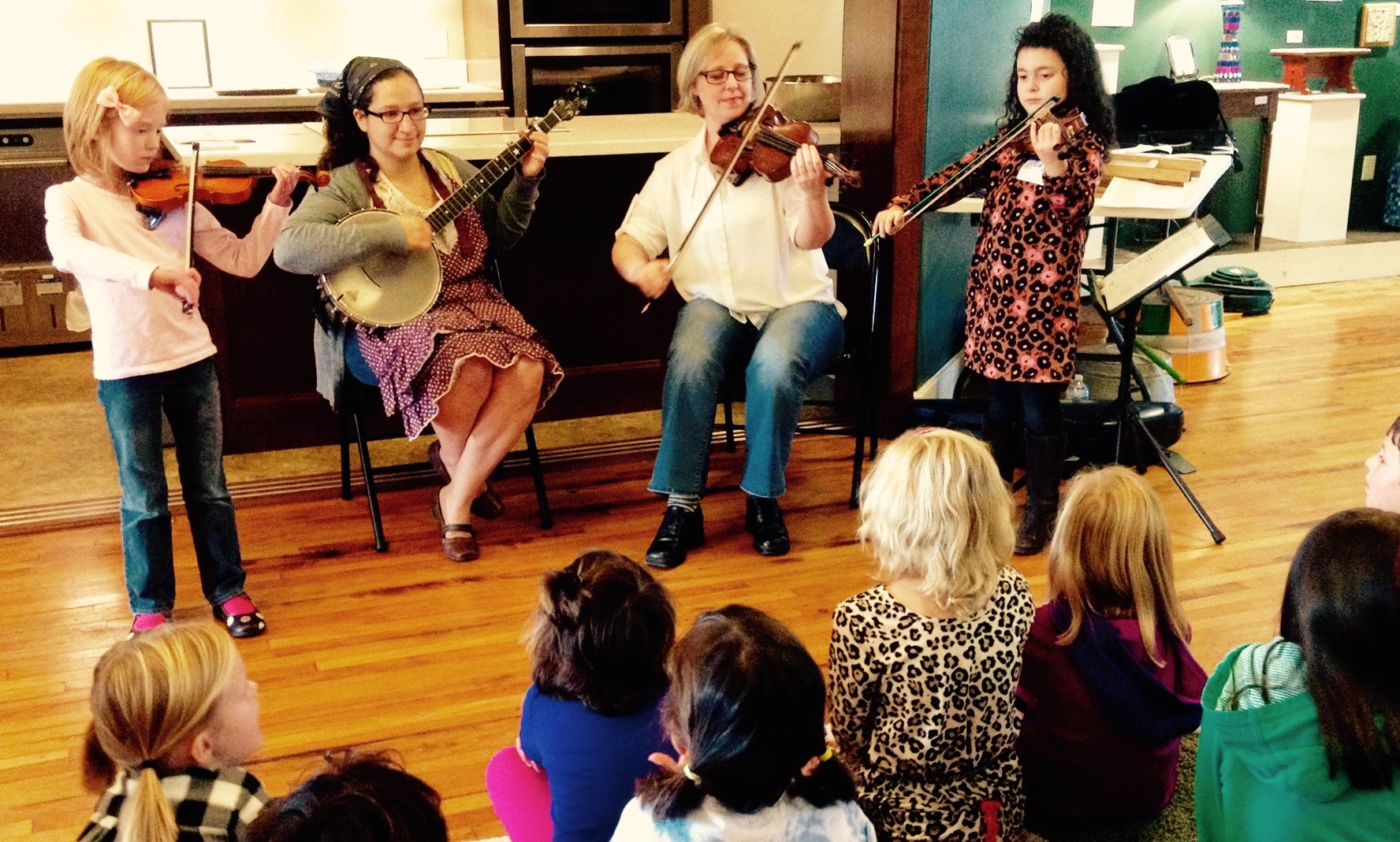 Abigail-fiddle, Camilla-banjo, Gretchen-fiddle, Lidija- fiddle (NCCM photo)