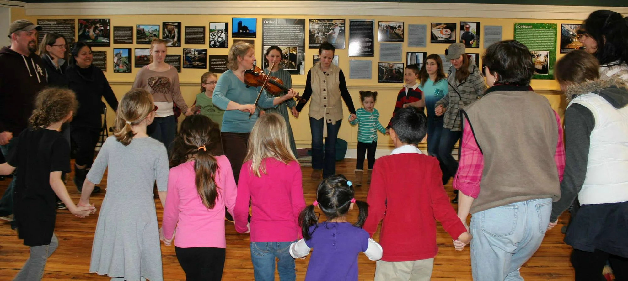 Fiddler/dance caller Gretchen Koehler teaches the dance La Bastringue. (Courtesy of TAUNY archives)