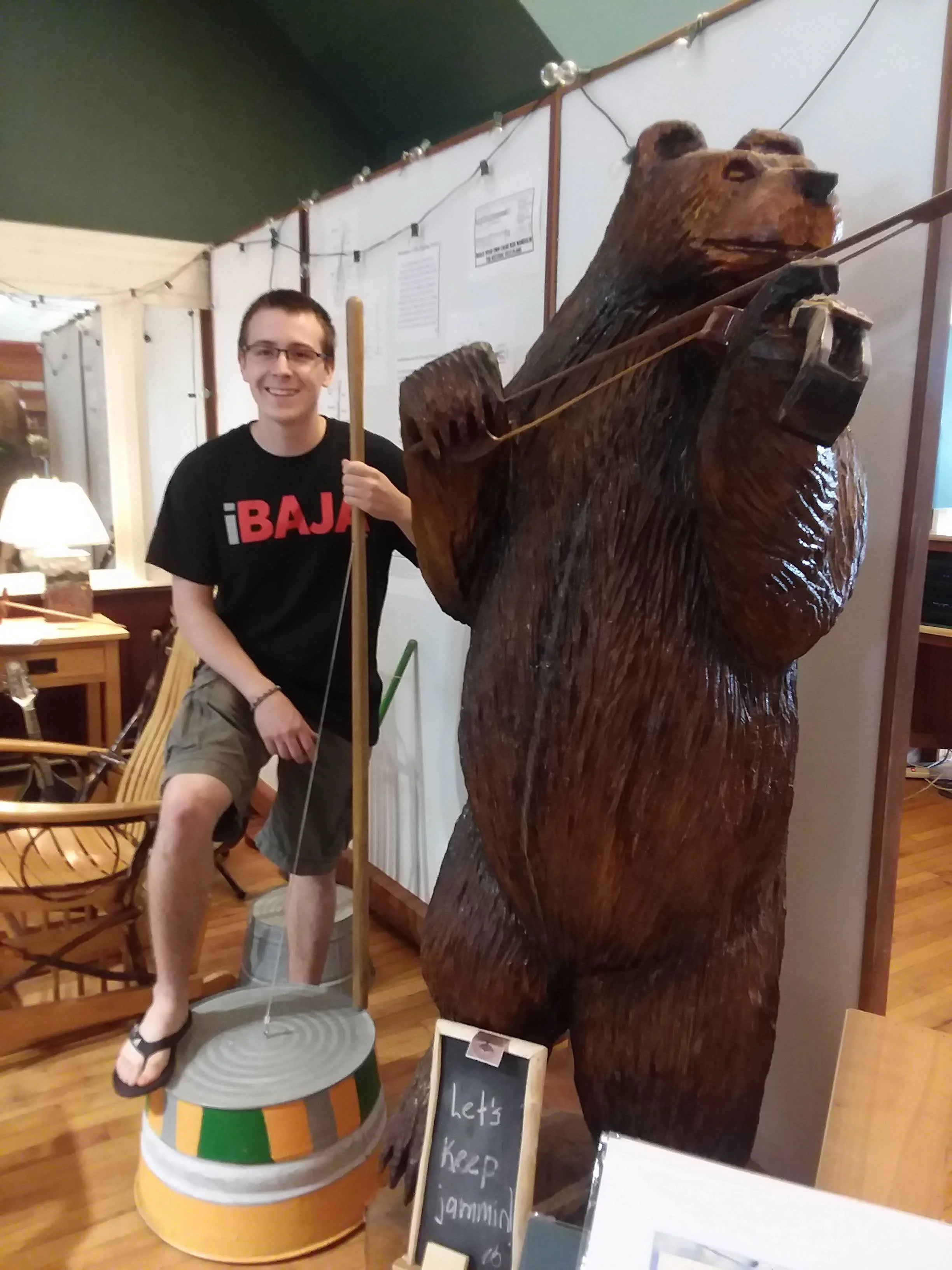 Gaetan Foisy (above) in the "Playing Parlor" demonstrating a washtub bass he donated for visitors to try. He made several basses with his neighbor/washtub bass aficionado, "Downtown" David Brown.