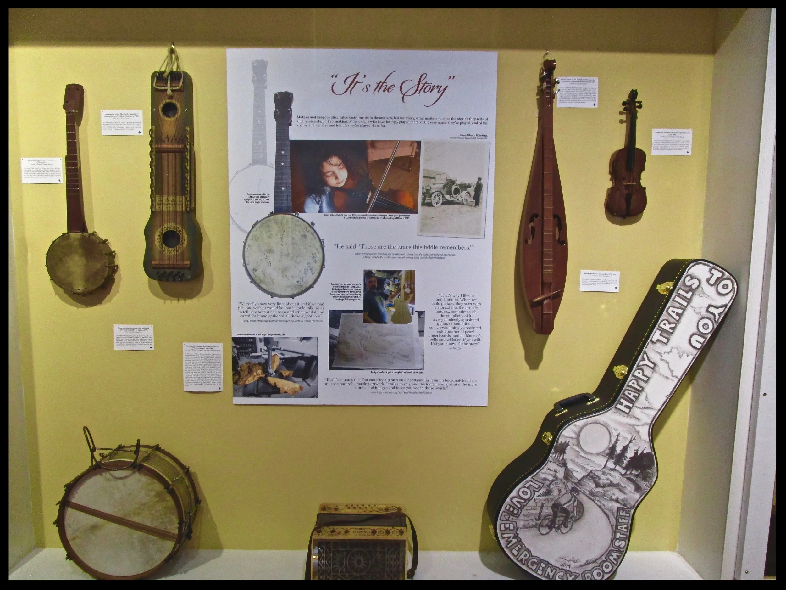 A variety of instruments from home collections, North Country museums and historical societies on display in the TAUNY gallery. Young Lidija Aldous (fiddle student of Gretchen Koehler) pictured playing the fiddle of J. Claude, Aldous, her great-grandfather.