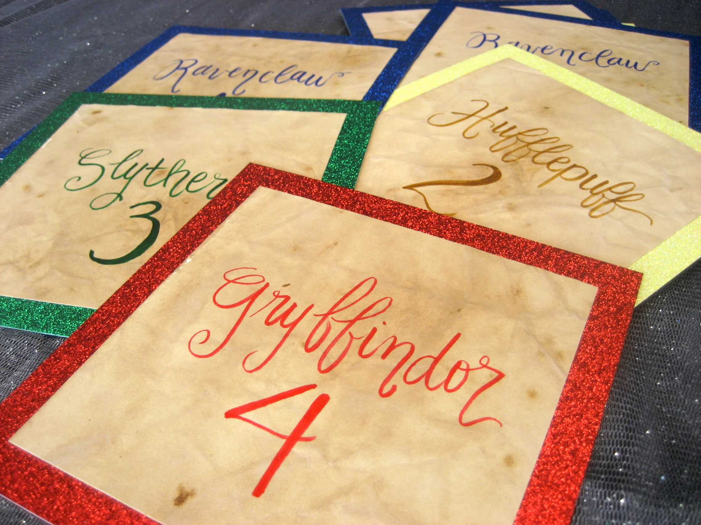 Sparkly hand-lettered table cards for a Harry Potter themed wedding!