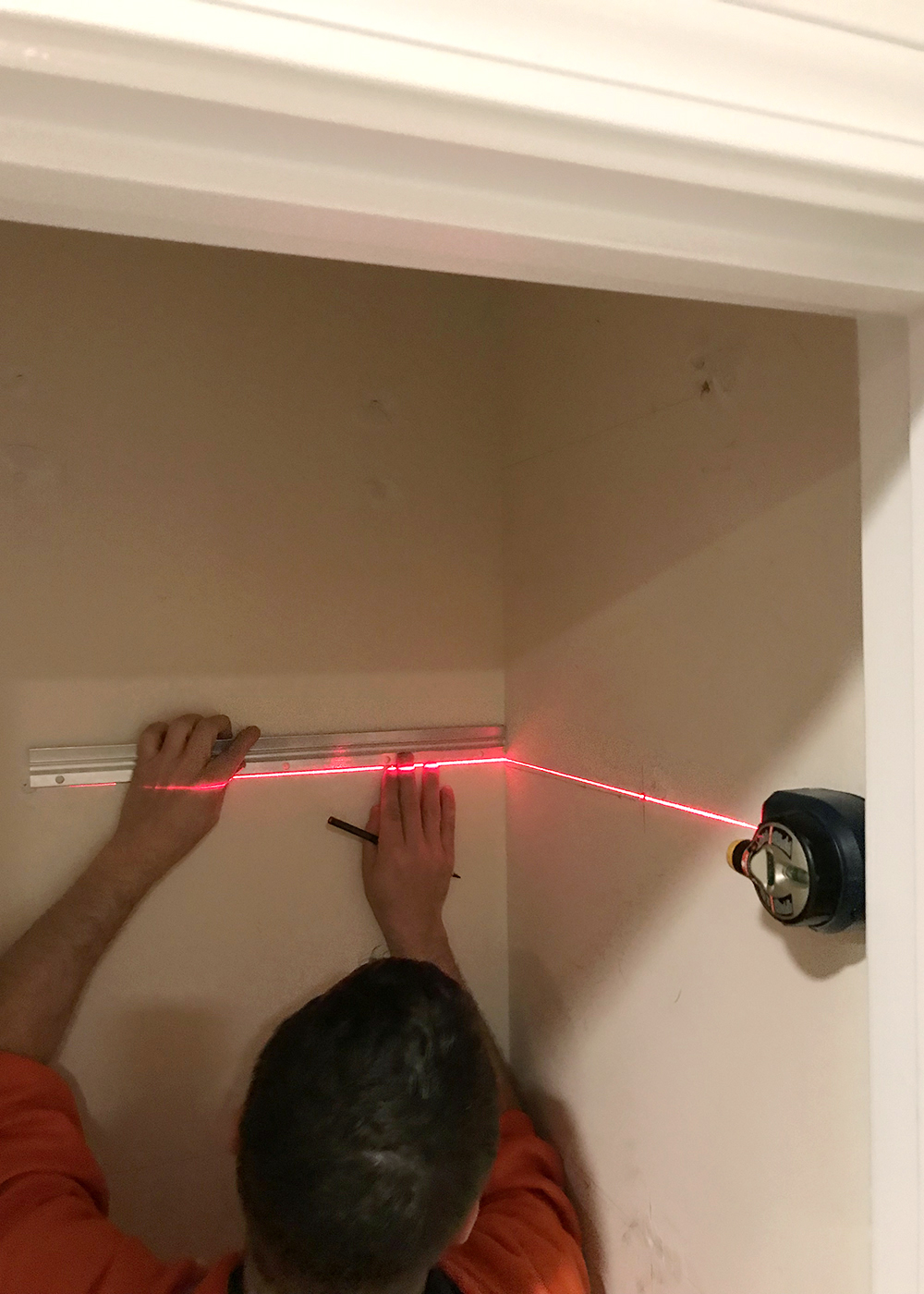 use a laser level to pencil in lines for new shelves