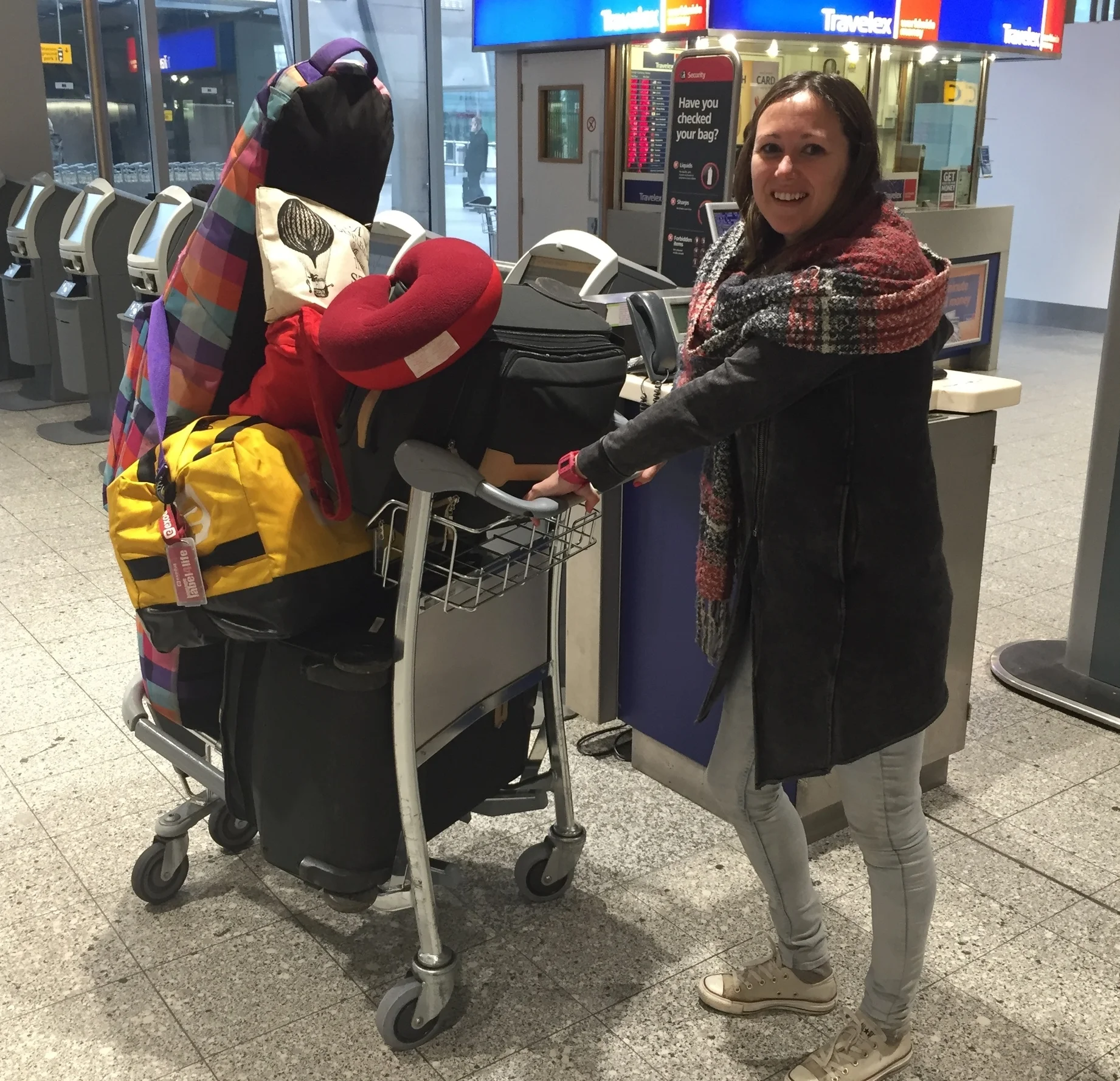 Emma Hodgkins and luggage full of donations