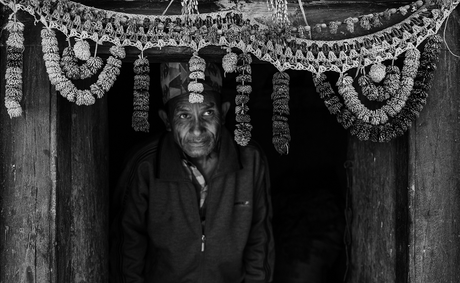 Dilip Singh Dhani, 55, emerges from his house to go and attend to his home garden which provides his family with vegetables. They are also able to sell off the excess produce to a nearby market. 