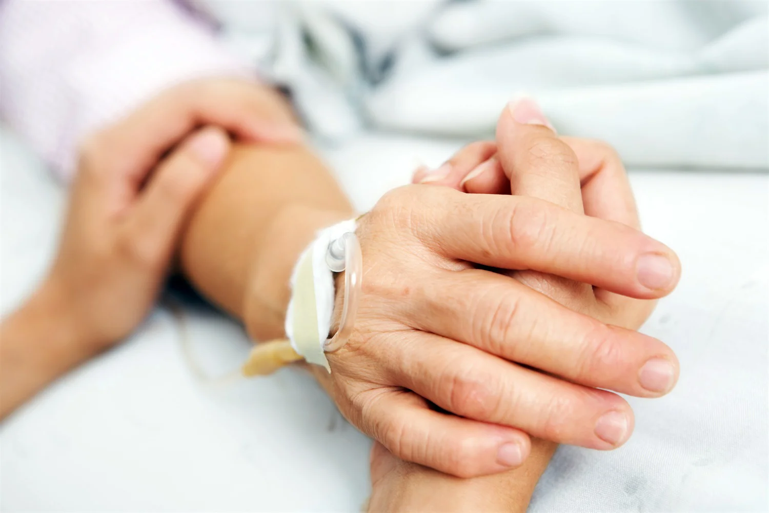 408_hospital_bed_hands.jpg