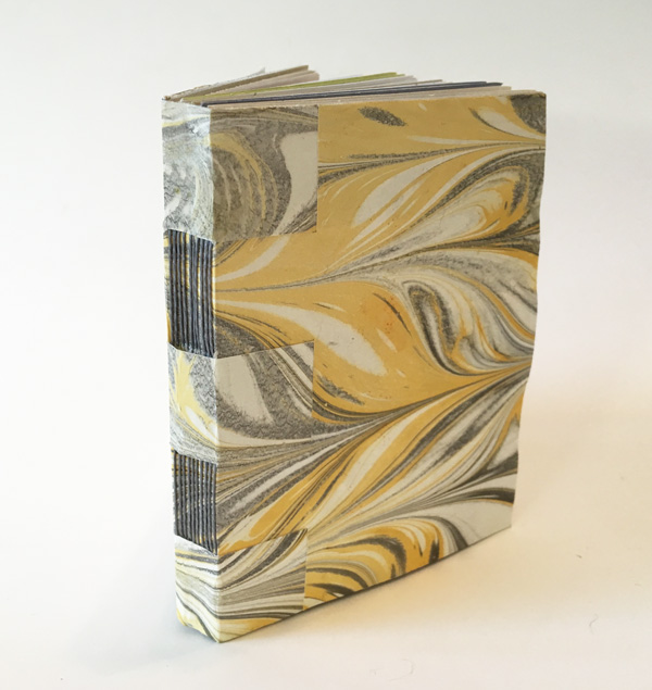 I'll be teaching this style of cross-wrapped binding on Saturday, Dec. 10 from 1-5 pm at Createful Studios in San Rafael. It's a softcover binding that works well as a journal or as a sketchbook because it opens flat. I made the marbled paper cover and used matching waxed thread to create this 4-1/4 x 5-1/2 inch, 40-page book. Link to class.
