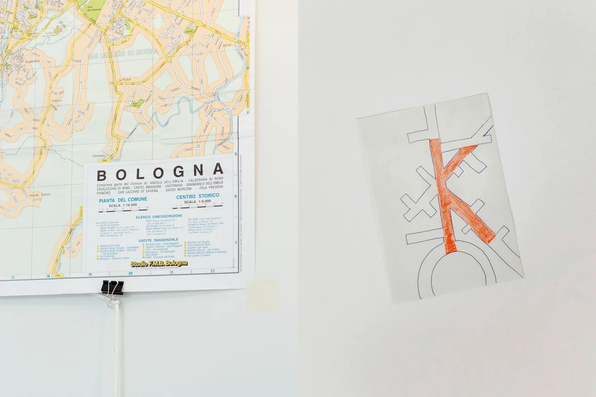 K _ by Christian Baraldi Bologna map The intricate maze of streets of Bologna, from the city center to the university area, from Piazza Maggiore to Giardini Margherita, you can see any sort of type in it. In between a roundabout, somewhere on the map where streets meet for a brief moment and then detach once again, there you can find the K of Bologna. (Paper, ink pen, colored pencil)