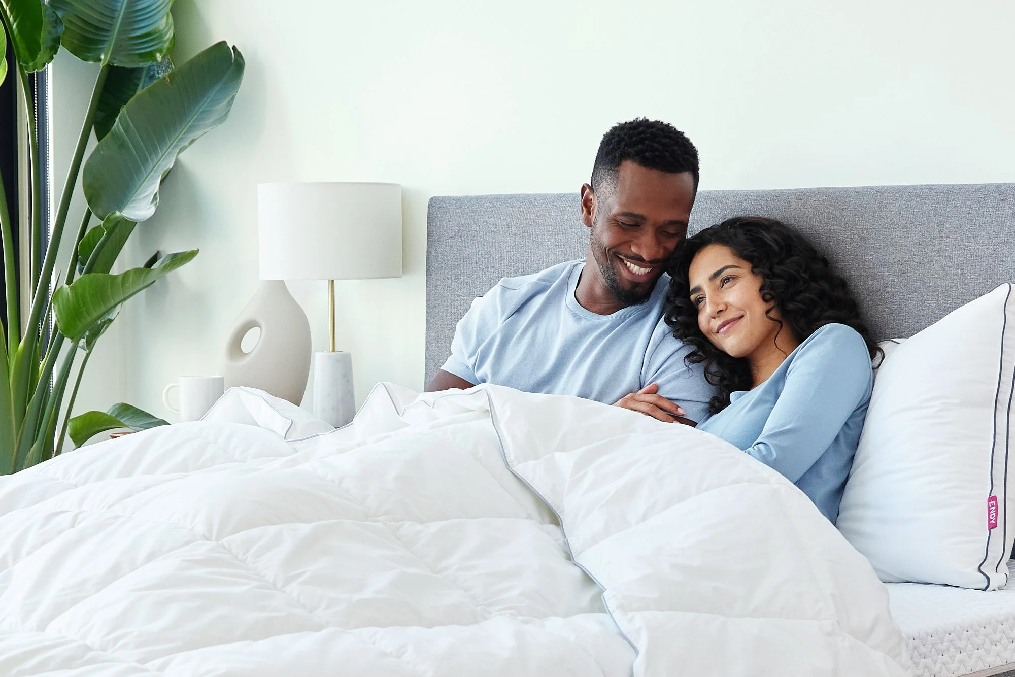 endy-blanket-mattress-bed-frame-couple-close-up.jpg