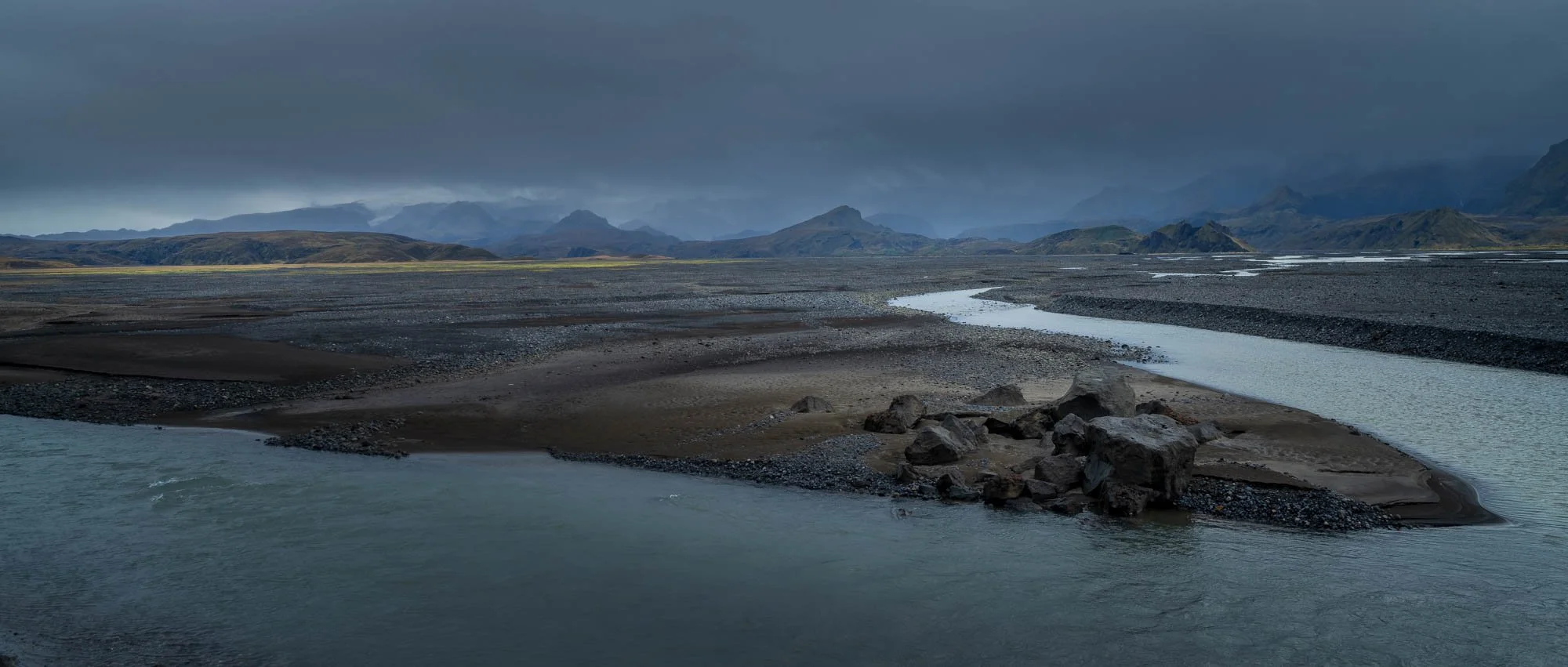 Fljótshlíð River Mouth Under Storm Clouds.jpg