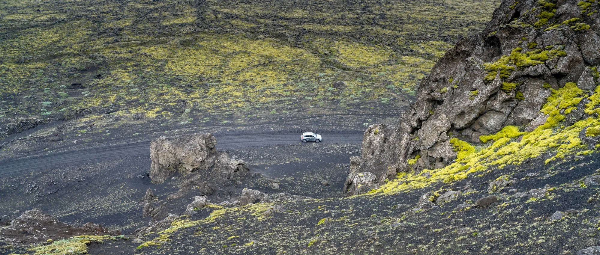 Vehicle Below Landmannaleið Lava Cliffs.jpg
