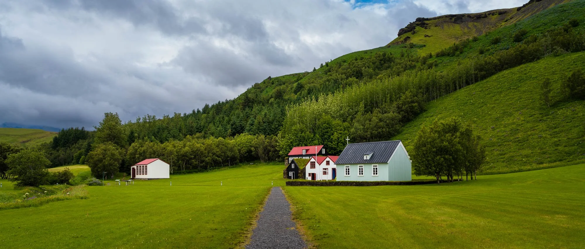 Farmhouse Below Green Hills.jpg