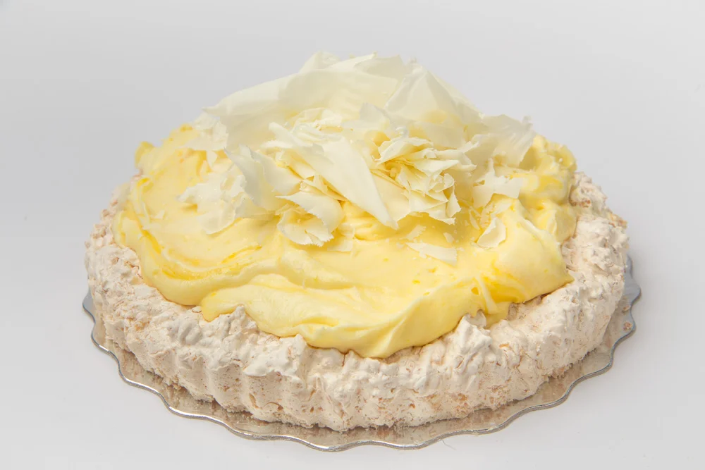 Lemon Mousse Coconut meringue shell filled with a lemony white chocolate mousse. Made without flour.