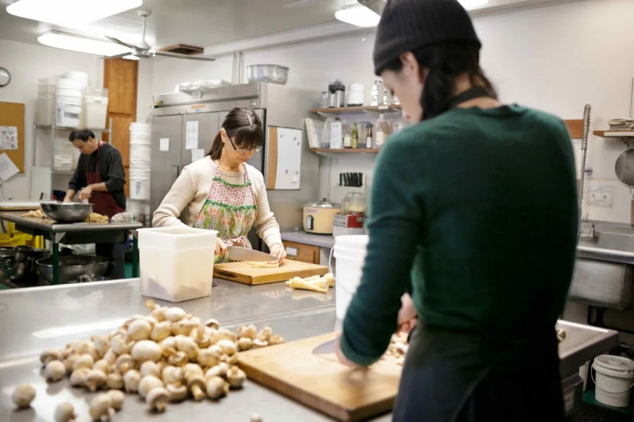 My friends Sabra, Kim, and Brian lovingly prepare a meal at the IMS Retreat Center. Photo by Willie Davis