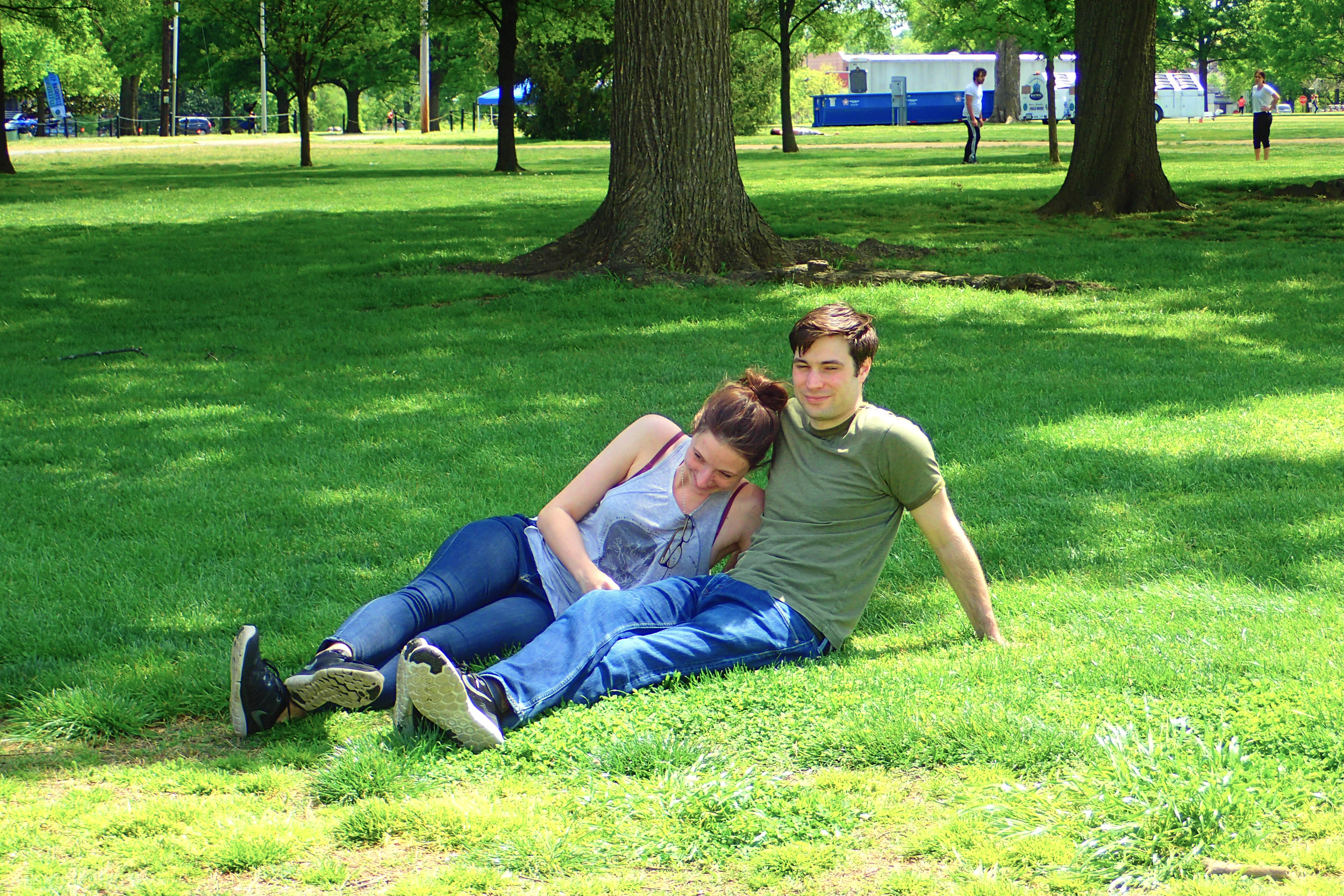 Jess and James lounging on the grass in Nashville