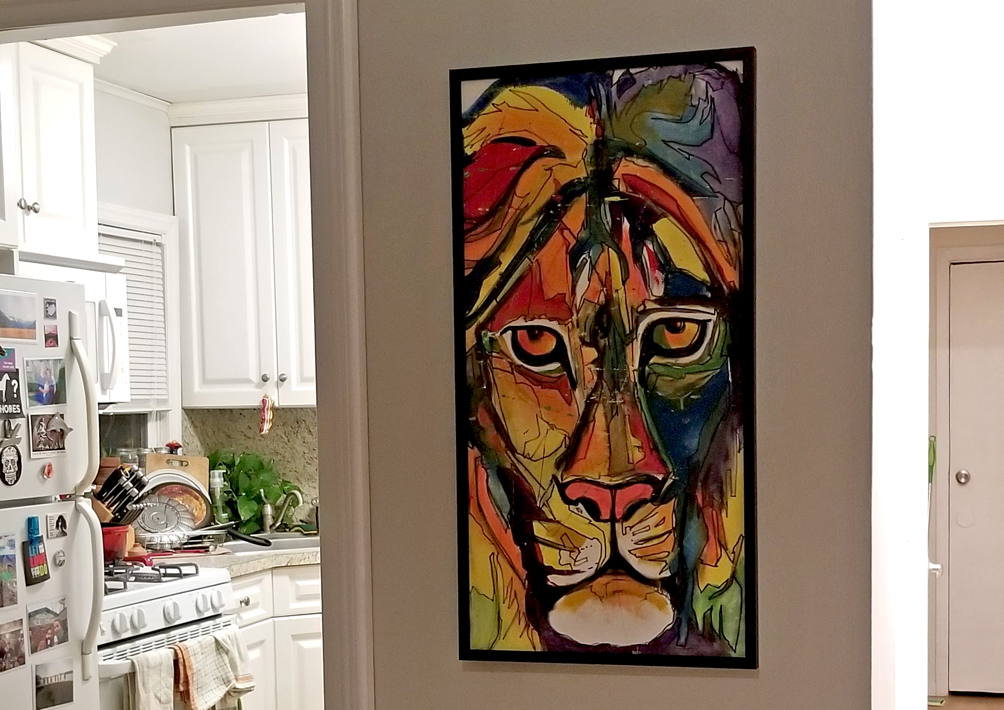 My lion painting hanging up at home (by Erik)