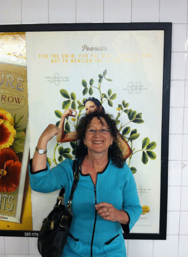 Wendy with one of the peanuts poster in the Subways of New York City.