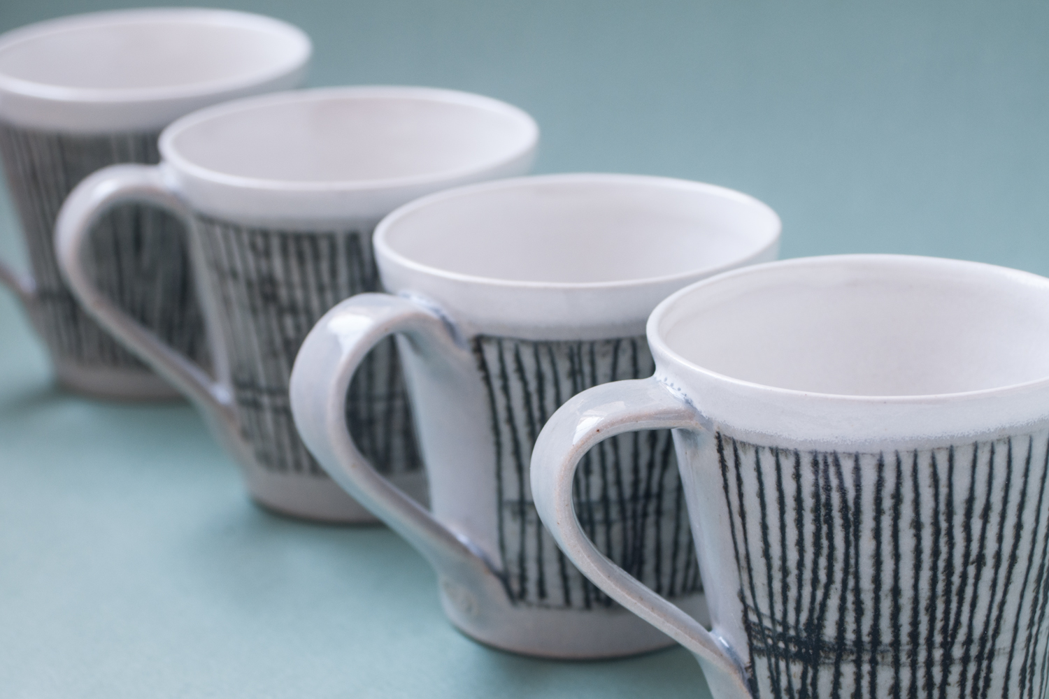 Topsy Jewell black and white striped ceramic cups