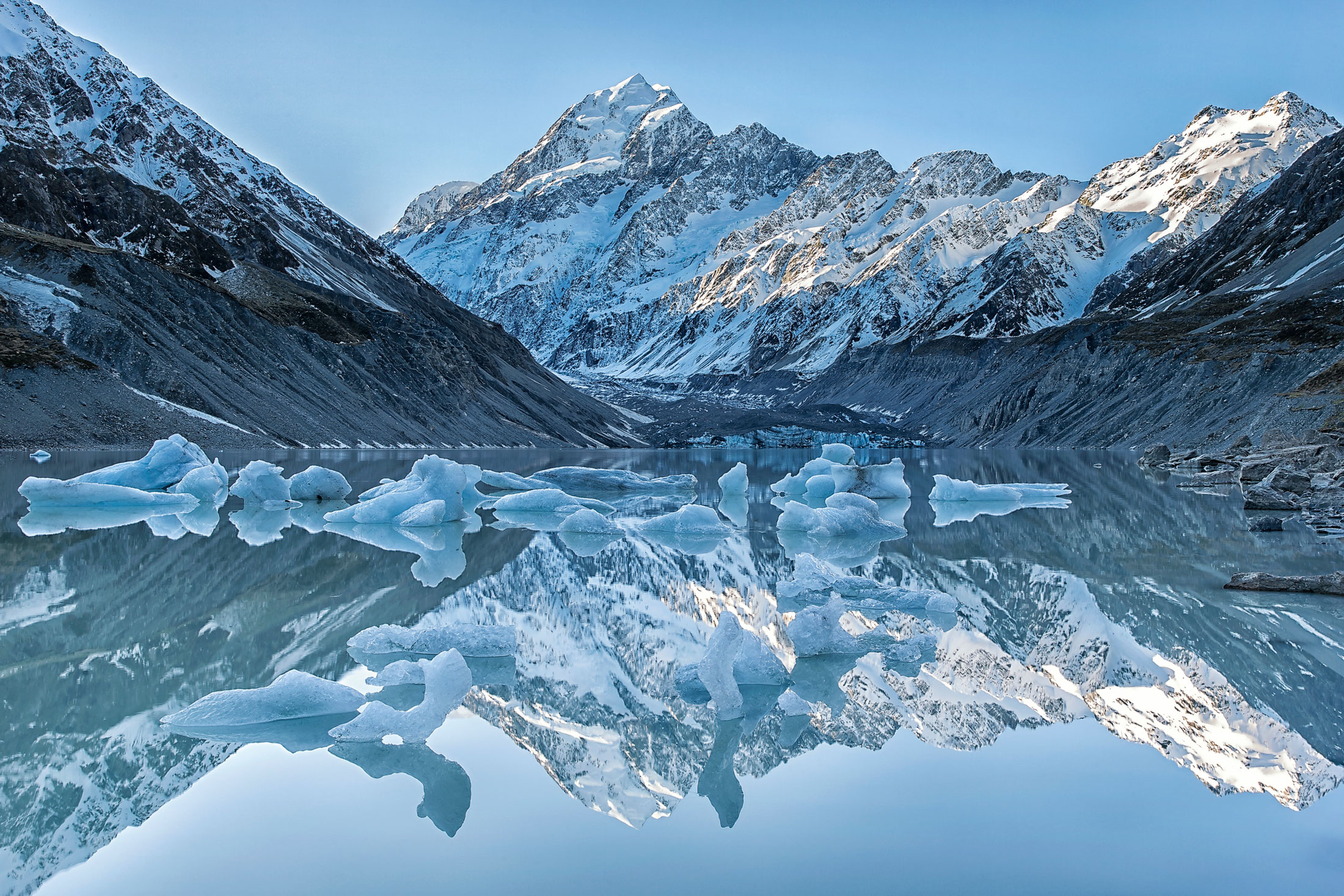 Reflections at Hooker Lake, Mount Cook, NZ – Mount Cook is one of my favourite NZ locations, you can see why! It was perfectly still this evening so the icebergs (rare in inland lakes) reflect beautifully in the lake.