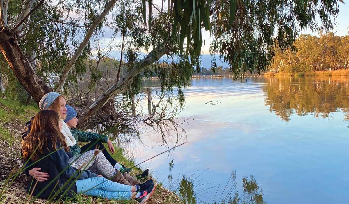 Katrina and the kids relaxing by the river. Image Katrina Denoux