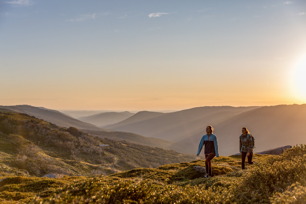 Hiking in the iconic Snowy Mountains bathed in summer sunshine. Image Thredbo