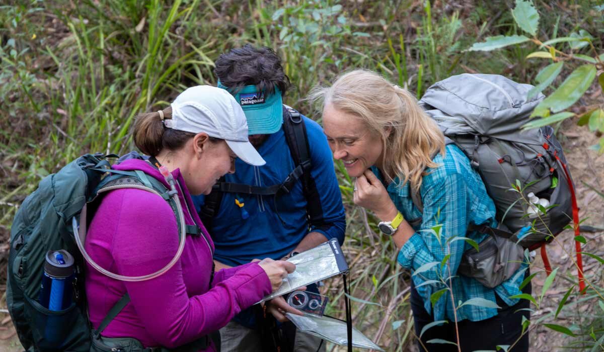 Caro checking student ‘s answers. during a navigation course. Image Rachel Diamond.