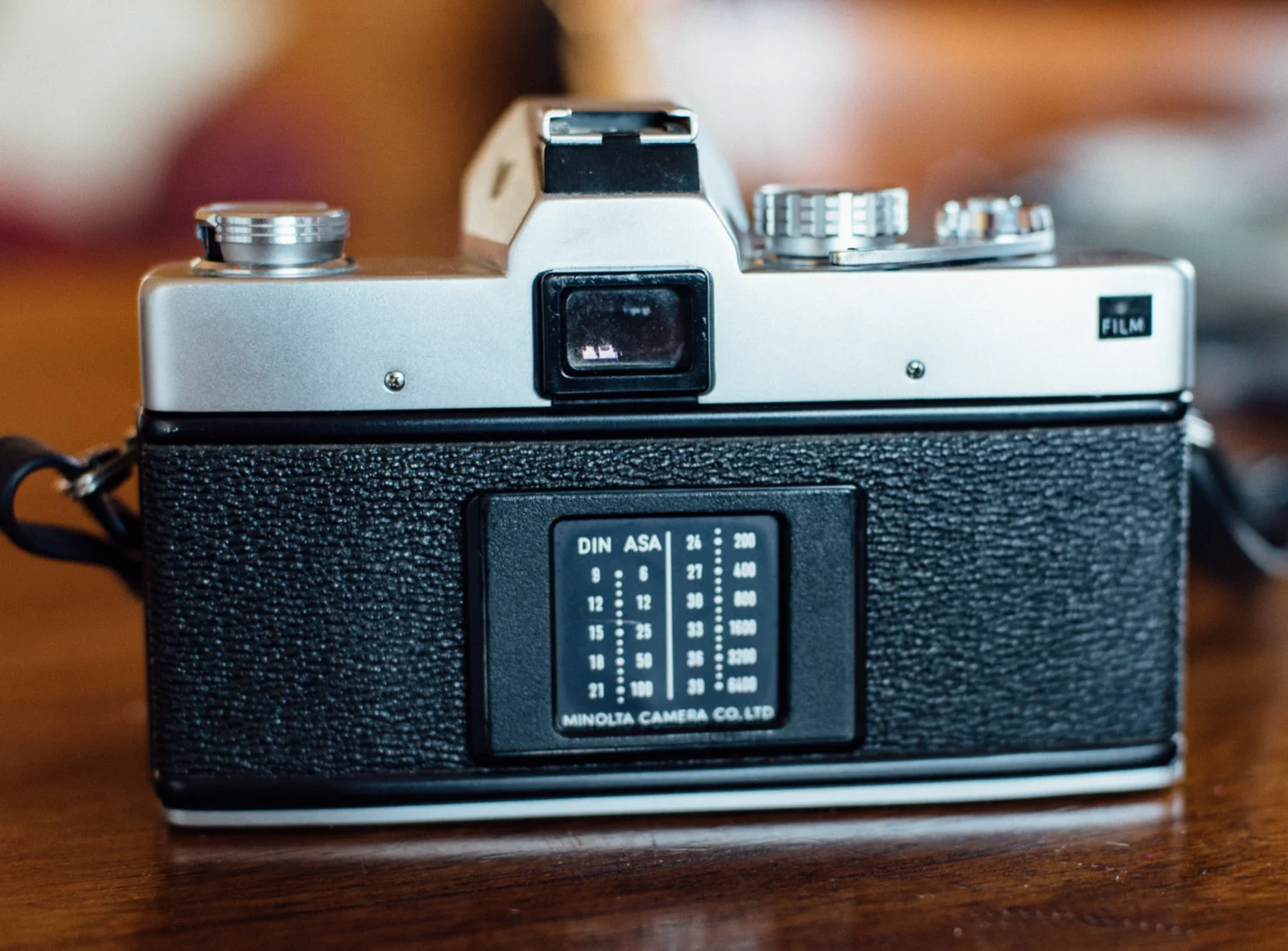 Rear of the Minolta SRT 303b. Film window has an orange stripe to show that film is loaded - very useful!