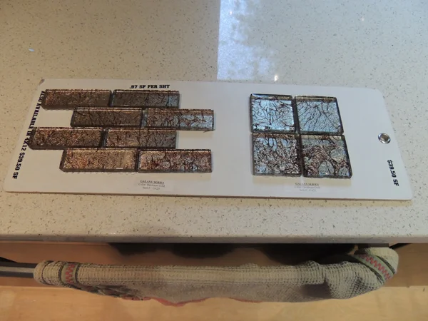 On August 25, we come home to find the right tile in the wrong color. Also: Using the dishwasher as a towel rack before our clever idea is executed. 