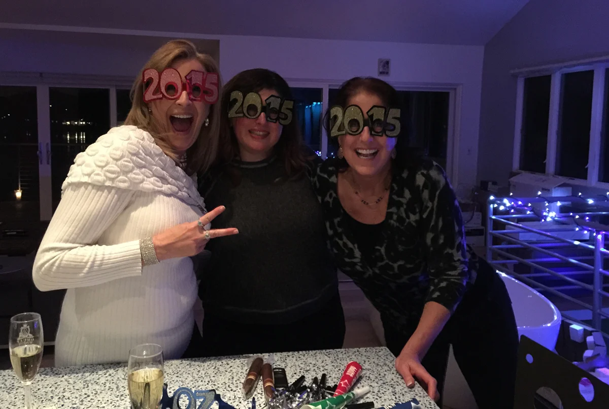 Revelers (that’s me in the middle) gather around the new kitchen island. The bathtub gleams in the background.