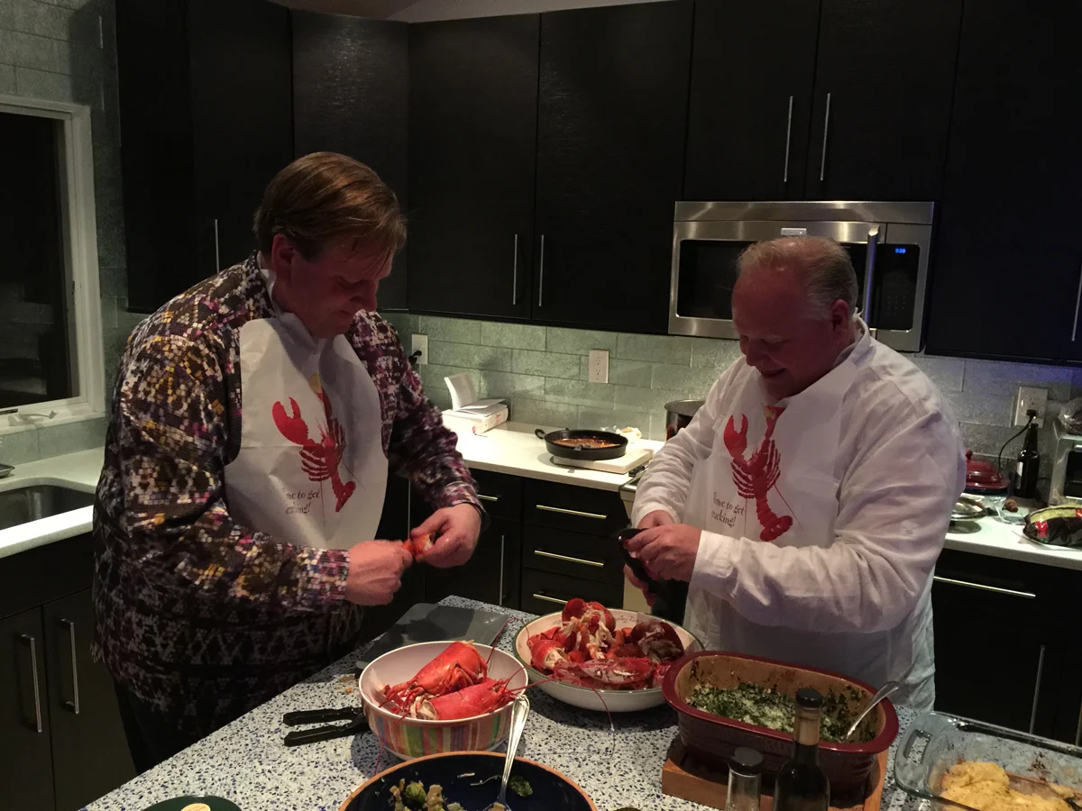 Handsome gentlemen crack lobsters for our first dinner party since we lost the upstairs bathroom.